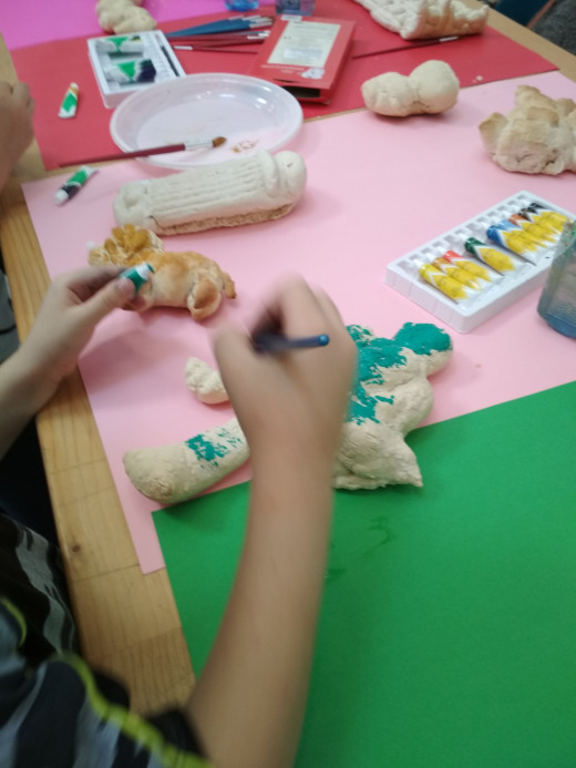 painted figures by children on the workshop of Shqipe Mehmeti