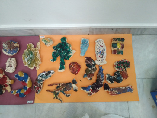 painted figures by children on the workshop of Shqipe Mehmeti